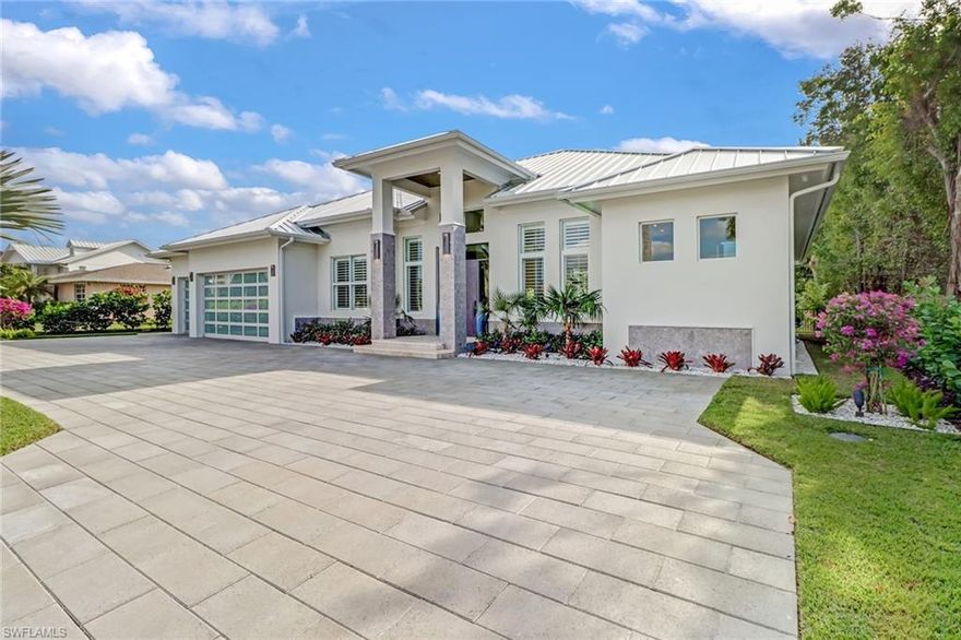 This one-of-a-kind gem in the heart of Coquina Sands will have everything you're searching for! Nothing will compete against this NIAN Custom Home! One step into this luxury oasis will leave you speechless. As you enter this upscale property you will instantly be greeted by a gracious open concept floor-plan boasting an 80 bottle wine cellar and a stunning pool with water feature peering through a 12-foot tall glass wall, all complemented by beautiful oak flooring and marble countertops. Everything in this home has had tremendous attention-to-detail including custom carpentry around the entertainment center with fireplace, Monogram appliances, gas cook-top, detached double fridges and a chef's pantry! Continuing out onto your patio, you will be greeted by an outdoor living space which includes an additional fireplace, outdoor gas grille with sink, all giving you that sensation of being at a private resort! Your luxurious master suite includes his & her walk in closets, a separate tub & a large walk-in shower with multiple shower heads and sauna feature! Other upgrades include mosquito spray system, landscape uplighting and motorized indoor shades in the living room.