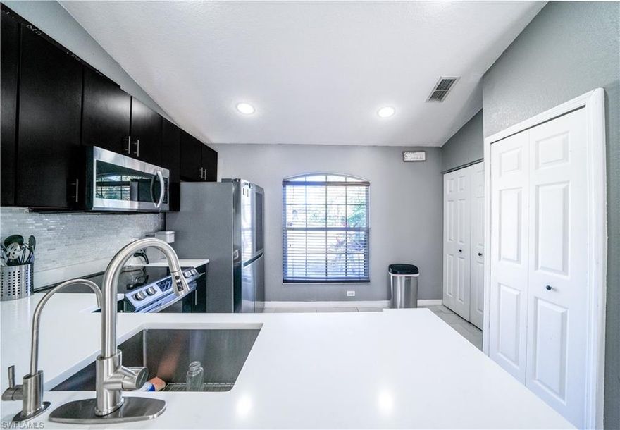 This charming cozy cottage home sits on 2.27 private acres. This modern style home has recently been updated with a new kitchen, new bathrooms, and a fresh coat of paint on the exterior of the home. The new kitchen features Quartz countertops, soft close cabinets, Samsung smart stove, Samsung microwave, & LG fridge. Enjoy the screened lanai and patio areas with southern exposure. In addition to the main home, there is a storage building on the property. There is more than enough room for a pool. Best of all NO HOA fees!!! Don't miss this opportunity to own a piece of paradise in Naples, FL!!! Home has a great location, minutes to Publix, CVS, Dunkin Donuts, schools, waterpark and recreational center.