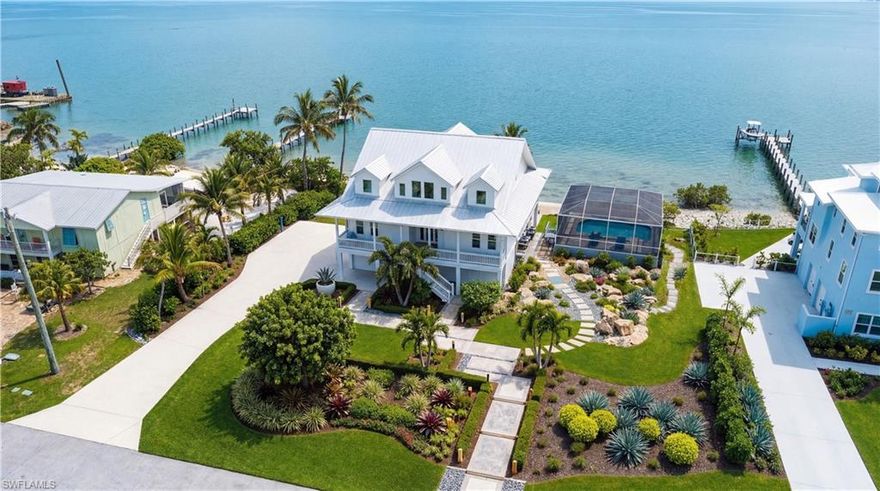 3211 VACATION LN IS A ONCE IN A LIFETIME OPPORTUNITY TO CREATE YOUR DREAM HOME ON PINE ISLAND SOUND! This 6 bedroom coastal estate is ready for your finishing touches. The estate features a new elevated custom pool and hot tub. The house includes new Anderson hurricane windows and doors. A $160,000+  ultra high-end kitchen is ready to install including Cafe' appliances! A new current code metal roof has been installed along with Hardy board exterior siding. The septic system has been upgraded to support 6 bedrooms/5 bathrooms.- Or less if you wish.
The 150' of bayfront presents breathtaking views of both sunrise and sunset of San Carlos Bay from the multiple decks, large hurricane impact windows and doors! Included in the sale are fully permitted and sealed renovation plans and blueprints.
Very few Vacation Lane bayfront homes ever hit the public market! Be one of the fortunate to secure this "Generational Opportunity"!
FIRST GROUP OF PHOTOS ARE OF THE HOME AS IT STANDS TODAY. THE SECOND GROUP OF PHOTOS DEPICT THE HOME USING AI AFFECTS SHOWING THE KITCHEN COMPLETED WITH THE KITCHEN CABINETS, COUNTERTOPS, AND APPLIANCES THAT ARE INCLUDED WITH THE PURCHASE. - And AI renditions of the home and property when completed.