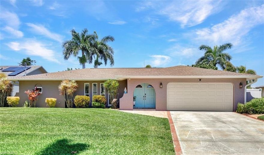 ATTENTION BOATING AND FISHING ENTHUSIASTS - This Beautiful Gulf access pool home is situated on the 100-ft wide Santa Fe Canal in Southeast Cape Coral. With only 1 bridge to go under, you are only 40 minutes to get out to the Gulf of Mexico. This 3 Bedroom, 2 Bath, Pool Home has been Updated and Remodeled with over $100,000 in Upgrades and Improvements. The Kitchen features Solid surface Counters, Wood Cabinets with Pull-outs, a Pass-through Window to the Lanai, Pantry, and New Stainless Steel Kitchen Appliances in 2021, including an Induction Stove. You will Love the Primary Suite with a Spacious Bedroom, Beautifully Updated Bathroom, Stunning Walk-in Shower with Multiple Shower Heads, Soaking Tub, Double Sink Vanity with Mahogany Counter and Copper Sinks, Good-sized Custom Closet, and Direct Lanai Access. 3 sets of Pocketing sliding glass doors expand your indoor living to the Large Lanai and Pool area outdoors, Perfect for Entertaining and Relaxing, whether you are swimming in the Saltwater Pool, enjoying the Spa, spending time with friends and family, or just soaking up the Florida sunshine. There is also an Outdoor Shower and a Pool Bath, as well as an Air Conditioned Office accessible from the pool area.The New High-end Composite Dock and 10,000 lb Boat Lift were both done in 2024. You also have the Convenience of a Kayak Launch. Additional Updates and Features include: New Washer 2026, New Upgraded Ceiling Fans 2025 and 2026, New Exterior Paint 2025, New AC Split System in Office/Storage room 2025, New AC 2024, Remodeled Primary Bath and Guest Bath 2024, All New Impact Windows 2023, New Multi-Stage Pool Pump and Filter 2023, New Roof 2021, New Water Heater 2021, New Fence 2021, New Carpet in Guest Bedrooms 2021, New Lanai Screens 2021, New Weatherhead 2021, Diagonal Tile, Crown Molding, Custom Bedroom Closets, Wood Shelving in Pantry, Dog Run, and Drop-down Ladder for Attic Access. The home was Repiped by the previous owner in 2008. All Bedrooms, Kitchen, Living Room, Family Room and Lanai are equipped with ceiling Fans. The Home has never flooded, is designated in X Flood Zone and does not require Flood insurance. All Utility Assessments are paid in full. Convenient location with easy access to Fort Myers, Southwest Florida International Airport, Punta Gorda Airport, and all of Cape Coral. Close to dining, shopping, entertainment, and schools.