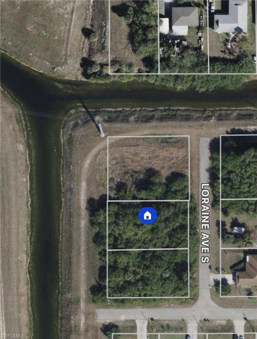 Excellent opportunity! Canal lot next to Lee Blvd! Good for builders and investors looking to invest in a rapidly developing area! Paved road and electric. Canal front. Surrounded by new homes!