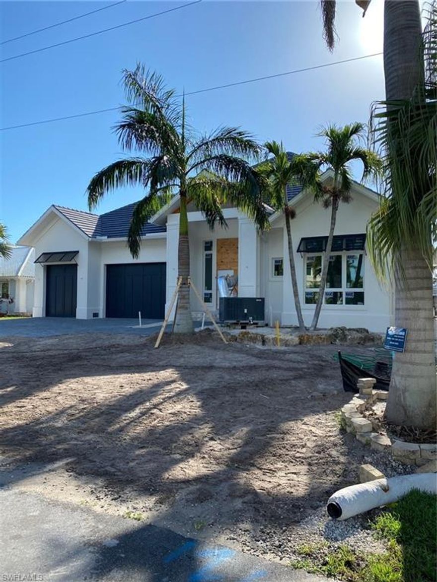 Custom home by Greenwald Builders offers exceptional amenities and unparalleled craftsmanship. This coastal inspired design is truly remarkable inside and out. Featuring single level living, along with a pool/spa and well appointed outdoor entertaining spaces. This home is situated on a canal in Royal Harbor. Watch the sunset with spectacular western exposure. Boaters will appreciate the new sea wall with direct no bridge access to Naples Bay and the Gulf of Mexico. It will be ready for your enjoyment in July 2020.