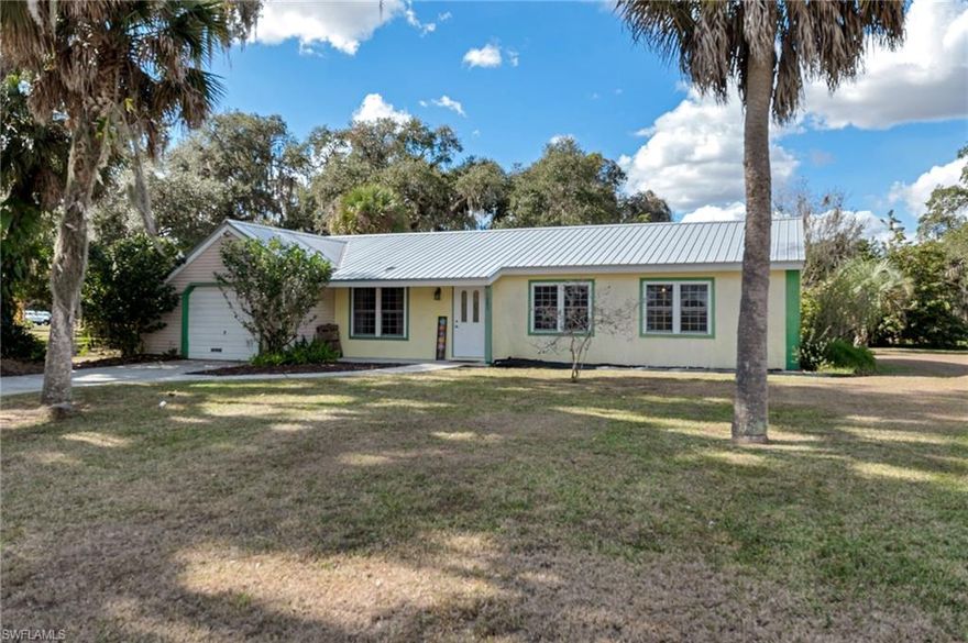 Welcome to this inviting 3-bedroom, 2-bath home on nearly one-half acre in the desirable Eucalyptus Village community of Port LaBelle, Florida. Thoughtfully updated and well maintained, this home features luxury vinyl flooring throughout and a newer metal roof, offering both style and peace of mind.

The spacious layout includes a versatile Florida room, perfect for exercising or hobbies, along with an attached garage for added convenience. Home has TWO laundry areas. There is a full laundry hookup inside the home and another one in the garage. A standout feature of this property is the additional lot adorned with absolutely beautiful, mature oak trees and even passion fruit vines, providing a park-like setting. This extra lot can be split from the home if desired, creating an excellent opportunity for expansion, investment, or added privacy.

Located in Eucalyptus Village, residents enjoy access to outstanding community amenities, including a community pool, boat ramp with access to a large lake, basketball and tennis courts, and a playground. This property offers the perfect blend of comfortable living, outdoor beauty, and neighborhood amenities—ideal as a full-time residence or Florida retreat.

Don’t miss this rare opportunity to own a versatile property in one of Port LaBelle’s most sought-after communities.