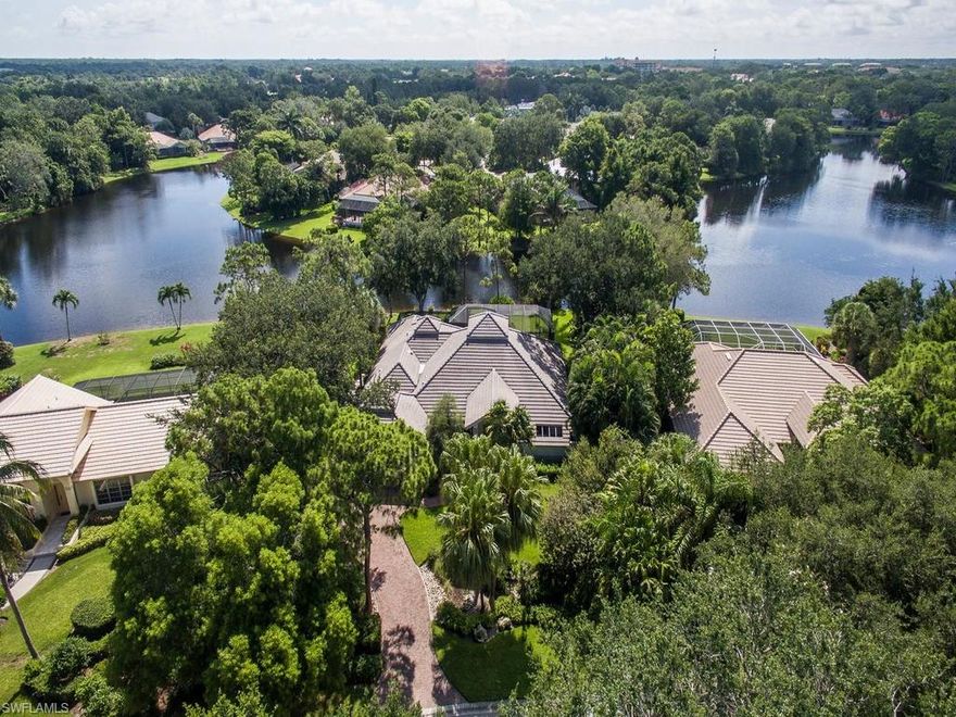 H.12037 - The enchantment begins here!  Extraordinary long lake views and privacy from all angles of the lanai and back yard of this lovely Woodlake home, with 120 ft. of lakefront. Enjoy your morning coffee with the sunshine of an eastern exposure from this lush, tropical view. The spacious 3,000+ sq.ft. home boasts elevated ceilings, gorgeous honed travertine marble floors, and a chef's kitchen to delight every gourmet cook with multitudinous Devonshire Cream raised panel cabinets, enhanced by the hand painted tumbled marble backsplash and a Thermador 6 burner gas range plus griddle and Wolf double wall ovens. Two new A/C units in 2014 and new duct work at the same time. The expanded master suite features a retreat for reading and an opulent master bath with separate water closet and bidet.  Bonita Bay is long celebrated for its environmental stewardship, award winning landscaping and creative land use, with 3 waterfront parks, 1,400 acres of open space, a 12-mile network of biking/walking paths and a private Beach Club. Optional Club Membership offers 5 championship golf courses, 18-court tennis complex and a new Lifestyle Center with state-of-the-art fitness, spa, and salon.