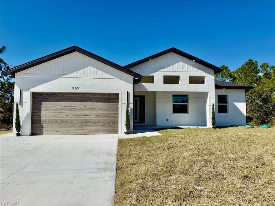 Brand New Home located on a quiet low traffic street on A HALF ACRE LOT, larger estate sized homes in the area, MOVE IN READY 4 BEDROOM 3 FULL BATHROOMS with TWO MASTER SUITES, EXCELLENT FOR IN LAW QUARTERS, C.O. HAS BEEN ISSUED, 24 X 48 POLISHED PORCELAIN TILE FLOORS THROUGHOUT THE ENTIRE HOME with 5 inch baseboards, impact resistant windows and doors, OUTDOOR KITCHEN ON LANAI OVERLOOKING THE BACKYARD, decorative wood color on garage door, extra concrete side drive off of the driveway for additional parking or turn around, covered front porch with seal coated floors leads to large great room with grand entry, coffered ceiling with decorative wood accent wall, high entry foyer with lighted decorative shelf, high volume ceilings throughout with tray ceilings in the living room and master bedroom, shaker cabinets with soft close doors and drawers, decorative lighting over breakfast bar, QUARTZ WATERFALLL COUNTERS WITH QUARTZ BACKSPLASH, stainless steel appliance package, large dining area with upgraded light fixture, spacious master bedroom with dual walk in closets, private bath with dual sinks with upgraded light fixtures including LED lighting built into the mirror, tiled walk in shower with frameless glass doors, 4th bedroom guest quarters off of the kitchen area with it's own private bathroom, indoor laundry room with built in cabinets, double garage with grey seal coated floors, excellent location just minutes to I-75, Ft Myers and SWFL International airport.