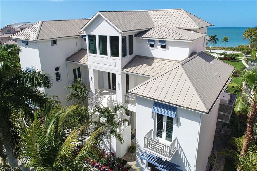 Presenting a just completed Barefoot Beach Gulf front luxury home. This custom home offers 1st class finishes throughout & a very rare horizontal sprawl across 1.5 half lots. This center estate position property offers both expansive Gulf frontage as well as bayside views. This property is draped in coastal sophistication, upon entering the main living you are greeted with wide plank oak flooring & beach views with an expansive open plan including a large living area with fireplace. This space includes a high quality bar with its own Gulf views. The kitchen offers large dual islands with custom quartzite thick bevel tops. The master suite in this home is one of the finest in Barefoot Beach & offers a generous sitting room with HDTV & fireplace, & his & her offices. The master bath is elegant with soaking tub, separate vanity areas & large double entry shower. For the guests there is a fantastic bayside cloud bar. Additional features of this home include 100' driveway, built in generator, 5 car garage, enormous lower storage area.