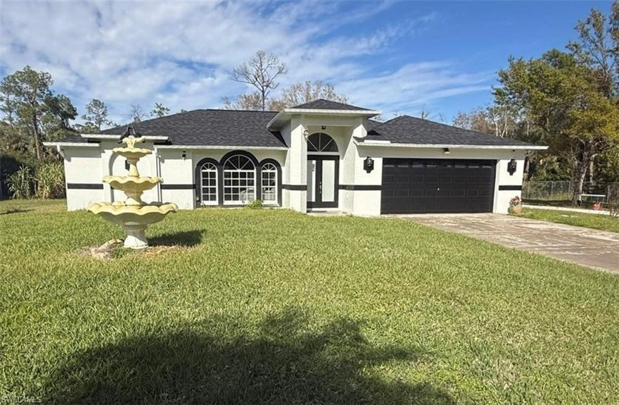 Furnished annual rental in Golden Gate Estates. Situated on over 2.73 acres of lush, private land, this 3-bedroom, 2-bathroom home comes tastefully furnished and is ready for immediate move-in. The expansive property offers unmatched tranquility and space to breathe. Perfect for those seeking a long-term residence without the hassle of moving furniture. Features include a spacious floor plan, modern finishes, and a massive backyard for outdoor enjoyment. No HOA! Contact us for more information or to schedule your tour today!