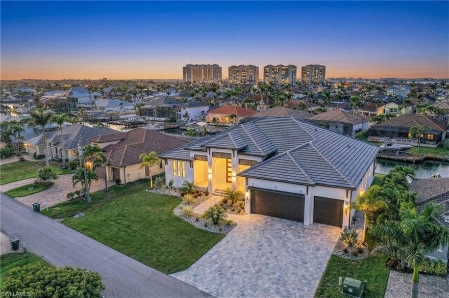 Rare opportunity to own a triple lot with direct sailboat Gulf access in one of Cape Coral’s most prestigious waterfront neighborhoods, located directly across from Cape Harbour and within walking distance to waterfront dining, boutique shopping, and live entertainment in one of the city’s most sought-after luxury communities.

This is a truly oversized homesite, offering 120 feet of waterfrontage compared to the standard 80 feet, and spanning approximately 0.34 acres versus the typical 0.23-acre lot. The additional width and depth provide the flexibility to build a larger custom luxury residence, incorporate a multi-car or RV garage, and still maintain valuable green space for privacy between neighboring homes—an increasingly rare feature in high-end Cape Coral waterfront areas.

Oversized lots like this are extremely hard to find, especially on established, high-end streets surrounded by custom waterfront estates. This property offers the opportunity to design and build a home that truly stands out and maximizes both scale and waterfront presence.

Positioned with desirable southern exposure, the lot sits on a wide 100+ foot canal and includes an existing seawall, saving both time and significant construction cost. The property is cleared and ready to build, making it ideal for buyers looking to move forward quickly on a custom waterfront home.

Boaters will appreciate the premium deep-water sailboat access with no bridges and no locks, allowing for quick and unobstructed access to the Caloosahatchee River, Gulf of Mexico, and world-class boating destinations including Sanibel, Captiva, and Boca Grande.

Located just steps from Cape Harbour, residents can enjoy a vibrant waterfront lifestyle with dining at Rumrunners, Fathoms, and The French Press, along with boutique shopping, art galleries, live music, car shows, and seasonal events—all within walking distance.

All city utilities are in place and assessments are paid, adding further value and convenience. This property represents one of the most desirable buildable Gulf access lots in Cape Coral, combining location, size, exposure, and boating access.

Whether you are searching for a luxury waterfront homesite, a direct Gulf access property, or a rare oversized lot near Cape Harbour, this is an exceptional opportunity to build a custom estate and experience the best of the Southwest Florida waterfront lifestyle. *Listing is for a lot only* Home is for example. Photos shown are of the Barrington II model from the Signature Series by award-winning custom home builder Arnold Roberts. Floor plans, specifications, and additional information available upon request.