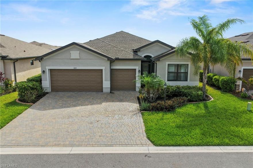 Gorgeous LAKE VIEW POOL HOME in a premier Fort Myers community. Featuring the popular Tivoli floor plan, this meticulously maintained residence offers 4 bedrooms, 3 full bathrooms, and a 3-car garage. From the moment you arrive, the attention to detail is evident, starting with the custom front screen door, allowing for wonderful seasonal cross-breezes. Built for entertaining, the expansive kitchen features granite countertops, a stylish tile backsplash, and custom wood trim on the kitchen island that adds a sophisticated, furniture-grade touch. The kitchen is completed by a breakfast bar, center island, stainless steel appliances, and a bright breakfast room. Adjacent to the main living area, the dining space is further elevated by elegant custom wood wall trim, creating a polished and inviting atmosphere. The spacious owner’s suite serves as a true retreat, featuring custom closet built-ins for maximum organization. The en-suite bath offers a large, glass-enclosed shower and two separate vanities. Outdoors, a paver lanai is enhanced by the sparkling, screened pool with Eastern rear exposure for beautiful morning sunrises over the tranquil lake. Additional features include diagonally laid tile flooring throughout the main living space, crown molding, a wide paver driveway, and lush tropical landscaping. Located in Portico, a gated community in a prime Fort Myers location, residents enjoy access to a clubhouse with a resort-style pool and spa, basketball, pickleball and tennis courts, a fitness center, and play area. Ideally positioned near I-75, shopping, dining, and everyday conveniences, this home offers easy access to everything you need. Come see what makes this lakefront home truly special—your next chapter starts here.