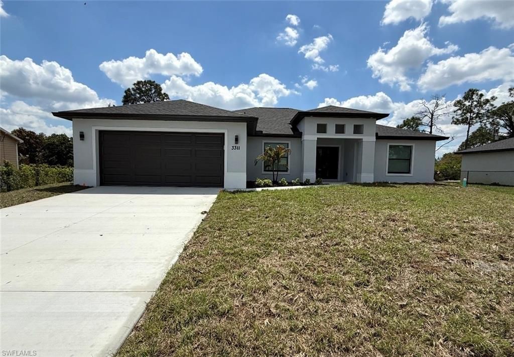 Photo of 3311 2nd ST SW, LEHIGH ACRES, FL 33976 (MLS # 226013656)