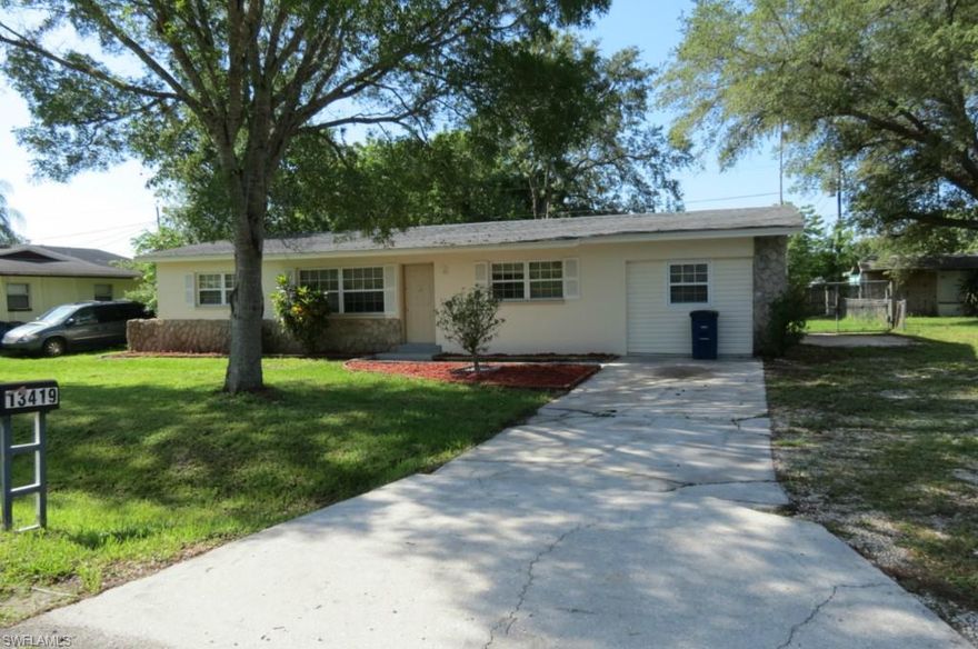 Wow... What a great pool home in Fort Myers Shores. This 3 Bedroom 2 Bath home features a split floor plan, Freshly painted inside & out also Tiled throughout. The Kitchen is updated with wood cabinets and plenty of counter space for the chef in all of us. Master bath has a large shower, guest bath has a tub. Large Lanai with a fence in yard, and a pool for entertaining on those Hot day's.  You Won't be disappointed  with this home has been a rental for years...@ 800.00 per month. Seller says bring all offers for review...