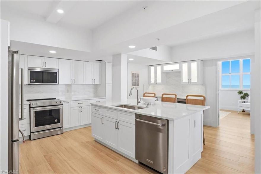 Coastal sophistication and Gulf-front elegance converge in this impeccably renovated 7th-floor residence, showcasing sweeping, unobstructed views of the Gulf of America. Encompassing 1,978 square feet, this refined 3-bedroom, 2-bathroom condominium embodies the very best of Marco Island living. An abundance of natural light fills the open-concept interior, where crown molding, wood-look tile flooring, and a striking coffered ceiling create a seamless blend of elegance and comfort. The thoughtfully designed kitchen is both functional and beautiful, featuring an expansive island, sleek solid surface countertops, stainless steel appliances, dual wine coolers, and abundant custom storage—perfect for both everyday living and entertaining. Step onto the spacious balcony to experience breathtaking Gulf vistas from sunrise to sunset, where turquoise waters and painted skies provide an ever-changing, picturesque backdrop. The primary suite offers a private retreat, complete with a cozy sitting area and a spa-inspired ensuite boasting dual vanities and a walk-in shower with multiple showerheads. Two additional bedrooms provide versatile space ideal for guests, a home office, or a personal studio. Residents enjoy an array of resort-style amenities, including direct beach access, a beachfront pool, fitness center, clubhouse, and tennis courts. Ideally located, you’re just moments from Caxambas Park, beloved local dining destinations such as Doreen’s Cup of Joe and the iconic Snook Inn, as well as the Shops of Marco for convenient shopping and entertainment. From pristine sugar-sand beaches and over 100 miles of scenic waterways to world-class dining and endless outdoor recreation, this exceptional residence offers more than a home—it delivers the quintessential Marco Island lifestyle.