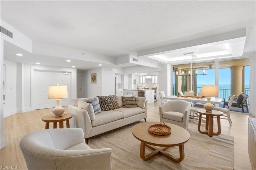 Coastal sophistication and Gulf-front elegance converge in this impeccably renovated 7th-floor residence, showcasing sweeping, unobstructed views of the Gulf of America. Encompassing 1,978 square feet, this refined 3-bedroom, 2-bathroom condominium embodies the very best of Marco Island living. An abundance of natural light fills the open-concept interior, where crown molding, wood-look tile flooring, and a striking coffered ceiling create a seamless blend of elegance and comfort. The thoughtfully designed kitchen is both functional and beautiful, featuring an expansive island, sleek solid surface countertops, stainless steel appliances, dual wine coolers, and abundant custom storage—perfect for both everyday living and entertaining. Step onto the spacious balcony to experience breathtaking Gulf vistas from sunrise to sunset, where turquoise waters and painted skies provide an ever-changing, picturesque backdrop. The primary suite offers a private retreat, complete with a cozy sitting area and a spa-inspired ensuite boasting dual vanities and a walk-in shower with multiple showerheads. Two additional bedrooms provide versatile space ideal for guests, a home office, or a personal studio. Residents enjoy an array of resort-style amenities, including direct beach access, a beachfront pool, fitness center, clubhouse, and tennis courts. Ideally located, you’re just moments from Caxambas Park, beloved local dining destinations such as Doreen’s Cup of Joe and the iconic Snook Inn, as well as the Shops of Marco for convenient shopping and entertainment. From pristine sugar-sand beaches and over 100 miles of scenic waterways to world-class dining and endless outdoor recreation, this exceptional residence offers more than a home—it delivers the quintessential Marco Island lifestyle.