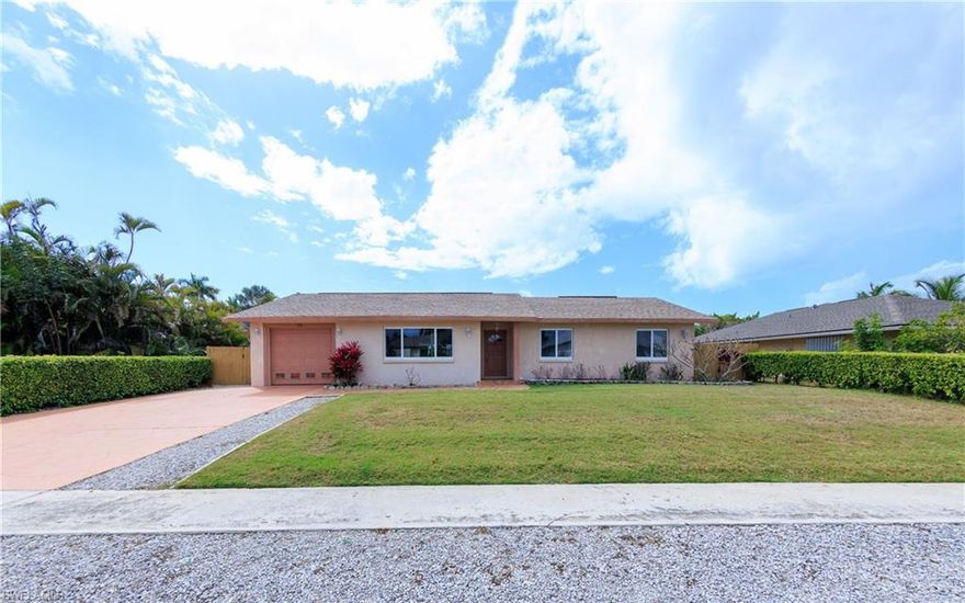 This well maintained home is wonderfully located for quick access to Resident's Beach, the YMCA, Mackle Park, nearby schools and all that Marco Island has to offer. Western exposure provides gorgeous sunsets all year through. Step inside to find a nicely updated interior with newer, large tile floors, granite kitchen with stainless steel appliances and bathrooms with dual vanities. The office/den includes a closet and can easily be turned into a 4th bedroom with an additional half bath. The washer and dryer were moved inside into the half bath, but everything is still in place to reinstall a shower and turn into a 3rd full bath. The entire home was replumbed in 2019 and for peace of mind during storms, there is a combination of newer impact glass windows on the front and manual shutters on the back. The large, zero-scape back yard is fully fenced and has plenty of room for a pool or to create your ideal recreation area. It also has access via a gate to park a boat, trailer or other vehicles behind the home. This home offers so many options for year-round living, and investment property or just a winter getaway.