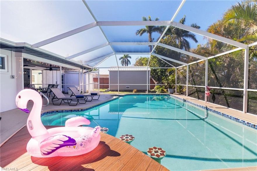 Direct-access waterfront home in Southeast Cape Coral with pool and no bridges to the Gulf. The property was fully renovated and offers an open living layout focused on water views and outdoor use. Interior finishes include modern flooring and impact sliding doors across the rear of the home for natural light and storm protection.

The kitchen features white cabinetry, solid surface counters, stainless appliances, and a custom island with built-in glass rinser and charging station. Main living area includes fireplace and flexible space for dining and seating. The primary suite provides updated bath and adequate closet storage.

Screened lanai opens to a pool area with swim-up bar. Seawall is extended and includes Captain’s Walk dock with boat lift, davits, kayak rack, and sailboat-depth water. City water and sewer connected with dual water systems in place. Shed and small workshop convey.

The home has operated as a vacation rental with 4.69-star Airbnb host rating and verifiable income history. Located off Del Prado Boulevard with quick access to retail, parks, and Fort Myers. Available for immediate occupancy and showings.