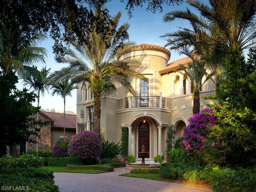 From the moment you enter the soaring two-story rotunda foyer, the meticulous attention to detail in this enchanting estate is evident. Residing on one of the premium homesites in all of Grey Oaks with sweeping water and golf views, this custom home offers over 8,000 square feet of living space, five bedrooms, six-and-a-half baths, plush theater, library/billiard room with custom built-in cabinetry, glass-tiled infinity edge pool with spa and owner's pool near the master bedroom. Other features include an elevator, elegant stone circular staircase, wine room and bar, 90-degree pocketing sliding glass doors, two fireplaces, his-and-her master baths, four-car plus golf cart garage, an expansive screened loggia with a summer kitchen and a spacious second floor loft. A world of luxury awaits you in this magnificent home minutes from the world class Naples' lifestyle.