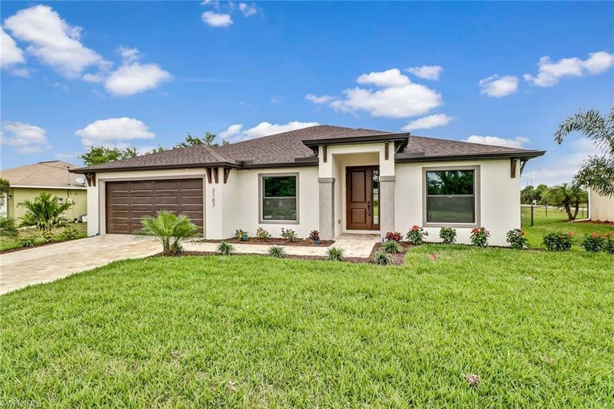 NEW CONSTRUCTION! Built by an award winning builder, this coastal home will impress! This concrete construction home features 4 bedrooms, 2 bathrooms, brick paver driveway and lanai. Full landscaping package including a 4 zone irrigation system. The interior features trey ceilings, 12x24 tile throughout the main areas with carpet in the bedrooms. Solid wood cabinets throughout with granite counter tops, Moen plumbing fixtures, and stainless steel appliances. Large master bedroom with a huge walk-in closet, dual sinks in the bathroom, and a separate tub and shower. Over sized garage great for storage! This home is super spacious and perfect for a large, or growing family.