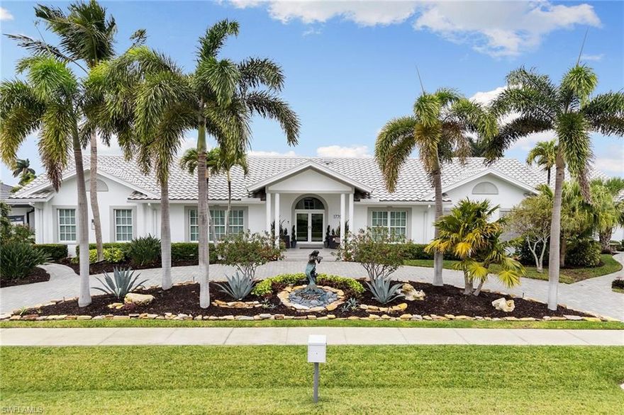 Experience the pinnacle of Florida waterfront living in this exceptional canal-front estate, ideally positioned on an oversized, beautifully landscaped corner lot with direct, quick-out access to the Marco River and the Gulf, a true boater's dream. Spanning 2,754 air-conditioned square feet, this 3-bedroom, 3.5-bath residence was thoughtfully designed to maximize space, light, and breathtaking long-water views. Soaring vaulted ceilings and an open, flowing floor plan create an immediate sense of scale and elegance, while custom built-ins throughout add both sophistication and function. The chef's kitchen is a showstopper, featuring quartz countertops, a unique glass tile backsplash, ceiling-height custom white cabinetry, and newer Bosch stainless steel appliances, all accented by dramatic programmable lighting—perfect for entertaining or everyday luxury. Every bathroom has been updated with new vanities, quartz counters, and mirrors, delivering a spa-like experience throughout the home. Large closets throughout. Additional major upgrades include two newer 3-ton Carrier A/C units with updated ductwork (2021), a concrete tile roof (2017), and impact-rated glass on the front door, sliders, and windows, plus Guardian electric hurricane shutters over the lanai for peace of mind. Step outside to your private resort oasis featuring an extra-large saltwater pool with integrated spa, a brand-new dock with Azek no-maintenance decking, a boat lift accommodating up to a 34' vessel, two jet ski lifts, awning for boat coverage, and pavers surrounding the entire home. An oversized side-entry 3-car garage, expansive circular driveway, whole-home generator with buried propane tank, and outdoor camera security system complete this exceptional offering.  The outside Mermaid Statue in front of the home is excluded.