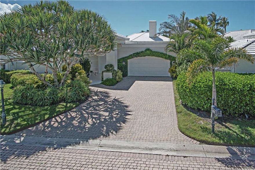 Stunning courtyard home enjoys southern exposure overlooking lush tropical landscape and waterscape view. Designed by renowned Norwood and Antonio Oliver Design Associates, New York City. Infrastructure, mechanicals, HVAC, electrical, appliances, kitchen, and laundry room completely replaced/renovated in past two years. Exterior spacious courtyard features refinished pool, new pool equipment, shell stone surfacing, mature plantings. Perfect outdoor living for entertaining. Interior features an open floor plan, fireplace, four full baths and two half-baths, cross-cut travertine, marble and porcelain tile floors throughout, and a separate two-room casita. All windows and doors are UV protected with Storm Smart electric roll-down hurricane/sun screens or high-impact glass. LED lighting throughout. New roof and gutters, 2020. Centrally located between Waterside shops, restaurants, and the Ritz Carlton Beach Resort. Amenities include three miles of beachfront, two private pavilions, restaurants, fitness center, tennis, pickle ball soon, private Golf membership, canoes, kayaks, and sunfish for resident use, miles of walking, and nature paths.  Enjoy the ultimate Florida resort lifestyle.