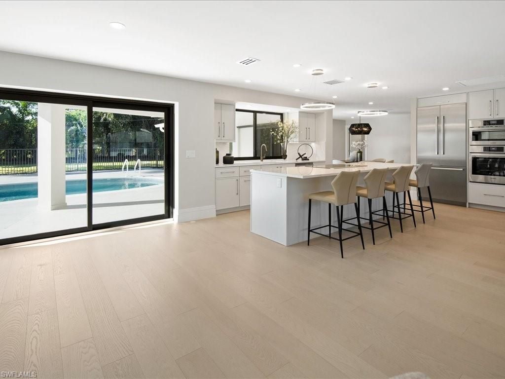 Photo of 518 Cypress WAY E, NAPLES, FL 34110 (MLS # 225029643)