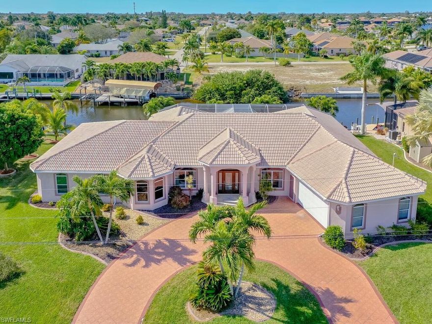 It's SHOWTIME!! Inspire your imigination with this Gulf Access Custom Built Home.From the minute you pull up to this triple lot site you can see this home is a rare find. As you walk through the front door your eyes are immediately drawn to the large open floor plan that was built with attention to detail making your life easier.   Every room in this home flow seamlessly into each other with lots of natural light and endless views of the pool/canal. Custom cabinets, large living and kitchen area for entertaining. High ceilings throughout. Large master suite with walk in closet. Have your morning coffee on the lanai that features an oversized pool/spa, kitchen and built in sauna. There is an 1008 sq/ft addition added to the home under air that served as a workshop that could easily be converted to extra bedrooms, bonus room or in law suite that gives you a total of 3800 sq/ft of living space. Imagine what you could do with this rare find. This could very well be your dream home or a used for a vacational rental. Boat dock has 8500 lb lift. Easy boating to the gulf with one bridge out.Enjoy endless sunsets from the lanai. Undeniable assets that make this property a unique oppurtunity