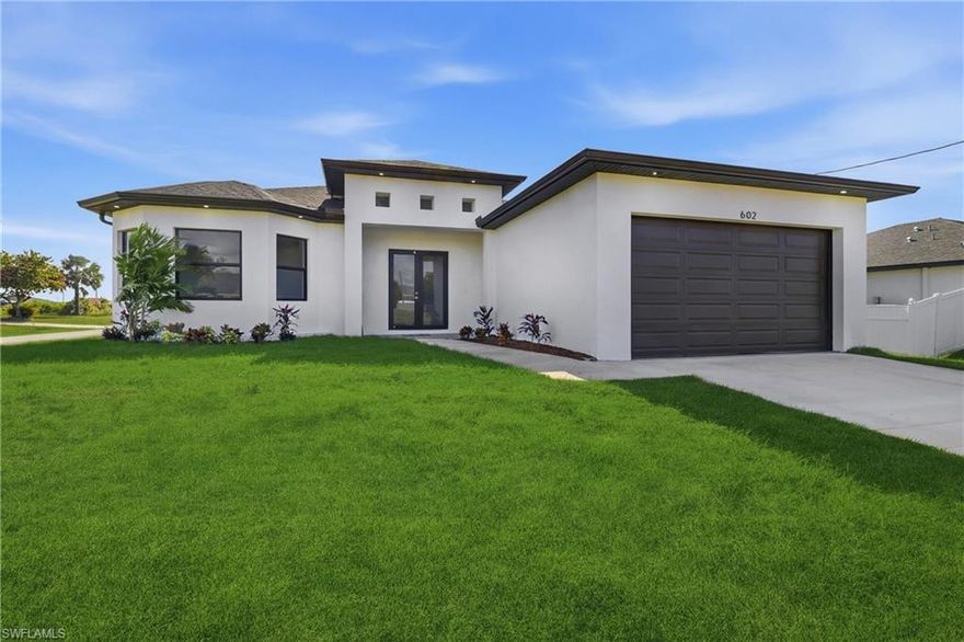 Beautiful 3BR + den, 2BA corner-lot home in desirable Cape Coral with partial water views. New construction featuring tile floors, an open kitchen with stainless steel appliances & custom cabinetry, washer & dryer included. Spacious yard with irrigation, room for a pool, no HOA, CO issued—move-in ready!