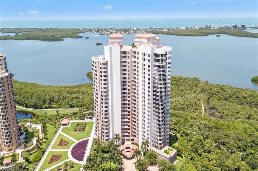 This 22nd floor unit offers close up views of Estero Bay as well as sunrises & sunsets. Unusual privacy for an end residence as it is adjacent to Estero Park. Secured elevator opens to an impressive foyer w/custom art lighting & nooks. Open floor plan w/custom upgrades incl. fireplace. Gourmet kitchen w/chef's center island, upgraded appliances, wine fridge, cooktop, natural quartzite countertops & breakfast bar. The owners' suite has custom decor, sitting area, 3 closets & private balcony. Mstr bath incl. oversized shower & jetted tub. Den/home office could be 4th bedroom. Separate & private guest bedrooms w/ensuite baths. Three terraces, one screened w/summer kitchen. Attached parking garage w/2 reserved spots, climate controlled storage unit w/access within building. Tavira amenities are many incl. rooftop terrace, club room, theater room, billiards room, golf simulator, gym, spa, pool & guest suites. Bonita Bay residents enjoy a private beach, 12 miles of biking, walking paths, 3 waterfront parks & a private, members only Country Club w/access to 5 golf courses & championship tennis courts. All furnishings included; just bring your suitcase and enjoy every day like a vacation.