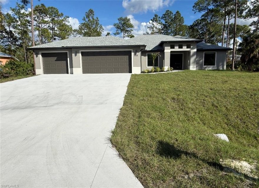 Stunning 4bedroom/3bath/3 car garage HALF ACRES new construction home in Lehigh Acres, FL. This Sable Palm Model Plus floor plan offers plenty of space for the whole family. The separate dinning and living room can also be used as flex spaces, hurricane rated windows and doors, PLUS an extra large garage situated on a HALF acres lot. Living room has custom designed TV wall decoration. Home features granite counter tops with wood grade kitchen cabinets. This home with 1 year full warranty and 10 year structural warranty.