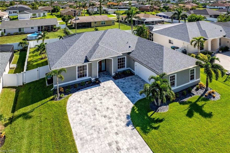 Motivated Seller ! This stunning home is FURNISHED, in mint condition and ready to enjoy Florida living at its finest. This Southern exposure pool home with fenced back yard features 4 Bedrooms, 2 Bathrooms. Enjoy all your family activities in furnished screened lanai with heated plunge pool with tanning ledge & bubblers build in 2019 overlooking private fenced back yard. Great Room floor plan with formal dining room will accommodate all your entertaining needs with custom designed kitchen by Cornerstone with stainless appliances, granite countertops, subway tile backsplash & tiled throughout. The oversized master bedroom with walk-in closet, master bath offers dual sinks walk-in shower and lots of natural light. Additional details this prestige home has to offer are new roof & gutter 2021, Trane AC with internal U/V light 2022, five Hurricane windows 2021, electric shutters on lanai 2023, electrical generator outlet & surge protector throughout the home 2020. This gem is located in one of the most sought-after neighborhoods of SW Cape Coral. Assumable Flood Policy Available! Policy rate $1,292. No flooding in hurricane Ian. Schedule your private tour!