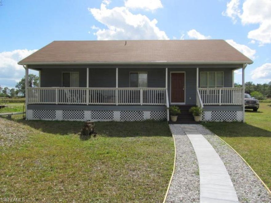 If you are looking for a fisherman's paradise, here it is. This 3 bedroom, 2 bath home is located on one of the nicest lots in Lehigh Acres and just moments to everything. Enjoy the view of the Able canal from the backyard deck, or take a few steps and cast a fishing line. Relax in your favorite rocking chair on the shady front porch and enjoy the peace and quiet the area has to offer. Updated with laminate flooring throughout, upgraded water treatment system and a new roof, this home has all one would need to enjoy the old Florida lifestyle and all at price which is hard to find. Don't miss out on this one!! ***AGENTS: PLEASE SEE CONFIDENTIAL INFORMATION FOR IMPORTANT SHOWING AND OFFER INSTRUCTIONS***
