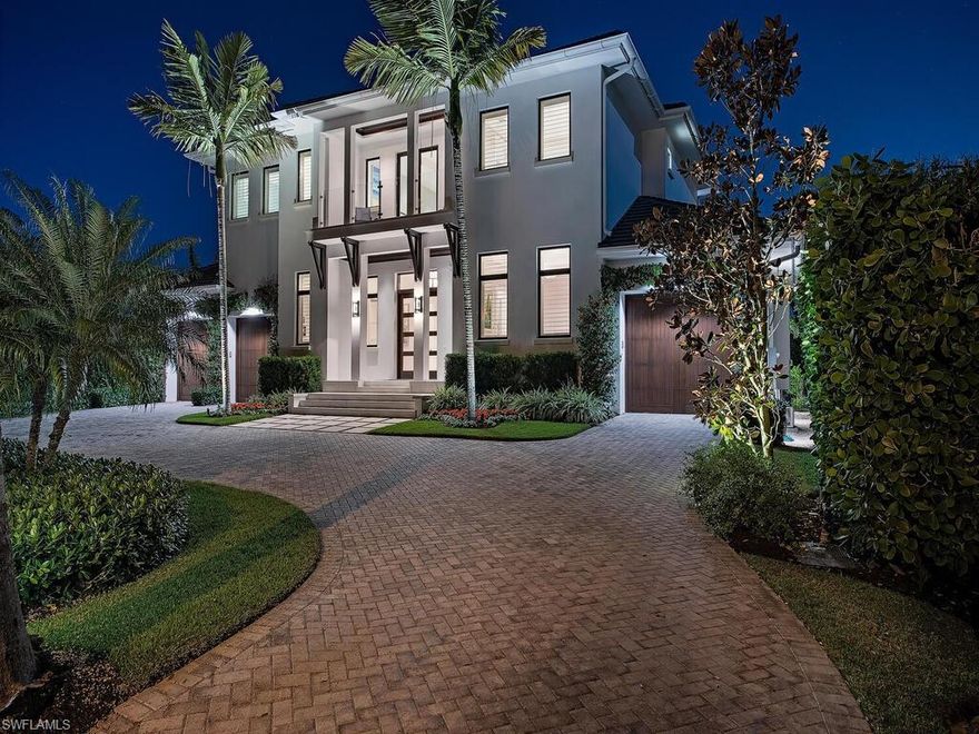 H957 Masterfully built Aqualane Shores home with sleek coastal contemporary design & world class finish built by Hemmer Construction and ideally situated 3½ blocks to the beach & walking distance to the historic 3rd Street Shopping/Dining District. The exterior elevation is enveloped in lush tropical environs w/ landscape lighting and features architectural gutters, decorative wood corbels, solid mahogany front & garage doors. The floorplan is spacious and welcoming with large volume ceilings, Master Suite and another guest suite on the 1st floor. Open concept design that has aspects of greatroom style living and multiple living spaces. Features include wide-plank long run Ash Wood flooring, full concrete construction, intricate ceiling detail, multiple fireplaces, whole house automation, custom light fixtures, dehumidification system & much more. Gourmet kitchen boasts Thermador appliances, Calcutta Borghini marble island, dual dishwashers, wall ovens, gas cooktop & custom cabinetry. Great outdoor retreat with gas fireplace, summer kitchen, tongue and groove ceiling detail, wall mounted TV. New sea wall, 70’ dock with 20K boat lift. This is the pinnacle in Aqualane Shores living!