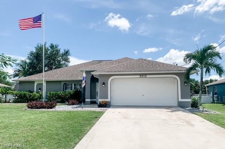 Looking for a cozy place to call home? Come see this beautiful 4B/2B pool home! All assessments are in and paid. Plenty of upgrades over the last year including: new pool motor and concrete overlay, new kitchen cabinets and granite countertops not only in the kitchen but windowsills and bathrooms as well, new doors out to the pool area are equipped with a built-in-blind system, new A/C, water heater and irrigation system. The Pebble Tec pool is heated by solar power and has a waterfall feature that makes sitting outside in the evenings extremely relaxing. There is a huge converted pantry right off of the kitchen and all stainless steel appliances. In this home you will find tile throughout with carpet in the living area, wood vinyl in all bedrooms and epoxy sealant on the garage floor. The property is beautifully landscaped with a fenced in backyard and 7 different types of fruit trees. There are fans in all bedrooms, living area and patio. House is in a very sought after area of SW Cape. Very close to Trafalgar Elementary and Middle, restaurants, shopping, grocery stores, and so much more!