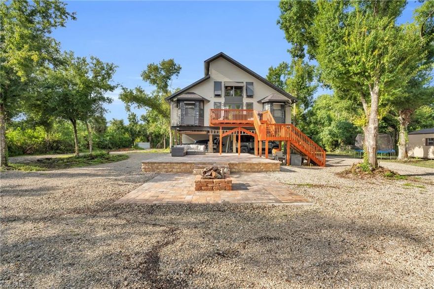 Welcome to this stunning property built in 2004, offering 1,960 square feet of living space. This home features 3 spacious bedrooms and 2 newly remodeled bathrooms. The interior is complemented by high ceilings and a convenient in-house laundry room, along with a pantry and extra storage. There's also a loft area that adds even more flexibility to this versatile space. Step outside to discover a freshly painted exterior and a new paved outdoor area complete with a cozy fireplace, perfect for relaxing evenings. The property also boasts all-new gravel and two freshly painted deck areas, ideal for outdoor entertaining. For those in need of extra storage or workspace, this property includes a massive 50 x 40, 2,000 square foot pre-engineered steel building, designed to withstand winds up to 160 MPH. The building has an impressive 18-foot interior height, making it perfect for a variety of uses. Additionally, there is a small shed and vehicle storage with three covered bays.
Set on a generous 1.81-acre lot, this property offers multiple entrances for easy access. Aluminum storm shutters are welded to the house for added protection. With plenty of room for all your toys and a beautifully maintained exterior, this property is ready to become your dream home.