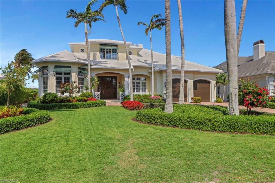 This exquisite Caribbean style waterfront home boasts wide water views and is one of the coveted “Nifty Fifty” that enjoys no bridges to the Gulf of Mexico!   Situated on an oversized lot with 120 feet of water frontage and 24,000 lb boat lift!   Masterfully crafted by Garrett Construction and impeccably maintained, this home is sure to impress even the most discriminating buyer.  This home offers 5 bedrooms plus den, as well as an additional loft/living area on the second floor. The first floor owner's suite offers a separate sitting area to enjoy the sparkling water view as well as a large bathroom and separate workout area.  The gourmet kitchen was renovated in 2017 with top of the line finishings and appliances. You’ll enjoy the Florida lifestyle watching sunsets and dolphins from your pool and lanai or you can hop on your boat or paddle board and enjoy the Gulf.  This home offers character and craftsmanship that you don't see very often these days and has too many features to mention.  Moorings is located just minutes to downtown Naples, restaurants, shopping, Coastland Town Center, golf courses, and more.  Moorings residents may join the Moorings Private Beach - just a few blocks away!