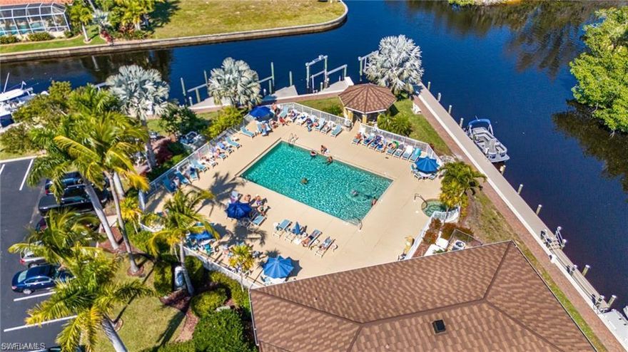 Lease available starting on 05/28/26.  Step into effortless Florida living in this beautifully maintained second-floor condo with elevator, located in the desirable Islanda Cove community. This spacious 2-bedroom, 2-bath residence offers an inviting open layout, a well-appointed kitchen with ample cabinetry, and a comfortable living area that flows seamlessly to a private screened lanai. Enjoy peaceful views and gentle breezes—perfect for morning coffee or evening relaxation. The primary suite features a two walk-in closet and an en-suite bath, while the guest bedroom and full guest bath provide ideal comfort for visitors. Additional highlights include in-unit laundry, tile flooring in main areas, and assigned parking and guest parking. Island Cove is a gated, waterfront community offering resort-style amenities: a heated pool, spa, clubhouse, tennis and pickleball courts, and a scenic boardwalk along the canal. This amazing community also features a kayak/canoe launch area with boat slips and deck around the two canals. With quick access to shopping, dining, and Cape Coral’s best recreation, this condo is an excellent full-time residence, seasonal retreat, or investment opportunity.  Little dog is ok (max 15 pounds)