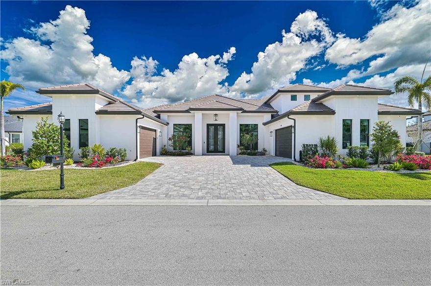 Located within the exclusive double-gated waterfront community of Tarpon Point/Tarpon Estates in Cape Coral, this private enclave of 45 homesites features a custom Tundra Homes residence. Completed in 2024 this home was crafted with exceptional luxury.

The home offers 4000+ square feet of living space including four bedrooms and 3.5 baths. A voluminous great room designed for entertaining. 14' tray ceiling, motorized window coverings.  Accordion sliders that open seamlessly to the outdoor living area. The gourmet kitchen is well-appointed with high-end GE Monogram stainless steel appliances. Includes a 60” side by side refrigerator/freezer, 36" cooktop, wall oven, air fryer/ microwave combo and dishwasher. The space is enhanced by custom wood cabinetry, large island, quartz countertops, ice maker and butler's pantry.  The owner's retreat serves as a private sanctuary with pool access, large soaking tub, walk-through shower and expansive walk-in closet.  The second floor boasts a 20’x27’ media/game room with motorized shades, potential for a bar/kitchenette and a balcony with stunning views of the pool and mangroves. This level also includes a guest bedroom and full bath.

Attention to detail is evident throughout.  10' double entry doors, coffered ceilings, 8' solid interior doors and plank tile floors. The residence is also equipped with a whole house water filtration system, smart home technology and 3 zone sound system. Car enthusiasts will appreciate the 2 separate oversized 2 car attached garages.

The private outdoor oasis includes a covered lanai with shell stone pavers, summer kitchen, outdoor shower, pool bath and heated salt water pool and spa. The home is equipped with impact windows and doors, security system with 12 cameras and generator. 

Tarpon Point residents enjoy seasonal concerts & events, a full-service marina w/ wet slips for vessels up to 125’, fishing charters, dolphin tours, boat rentals & water taxi to Ft. Myers Beach, stellar restaurants, boutiques, day spa, two pools, hot tub, sauna, fitness center and tennis.  Private helipad adjacent to marina.  www.tarponpoint.com