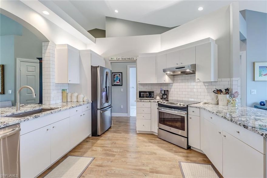 Completely remodeled with all new impact windows, sliders and doors!! Spacious 3 bedroom condo with split bedroom plan and vaulted ceilings located in The Strand Country Club at Wedgewood. Includes gourmet kitchen featuring stainless steel appliances, gorgeous granite, updated bathrooms with tile floor and gorgeous wood flooring throughout. Garage has new epoxy floor ! Enjoy a lifestyle that offers tennis, pool, fitness complex, and 27 hole golf course. To see this home is to fall in love!