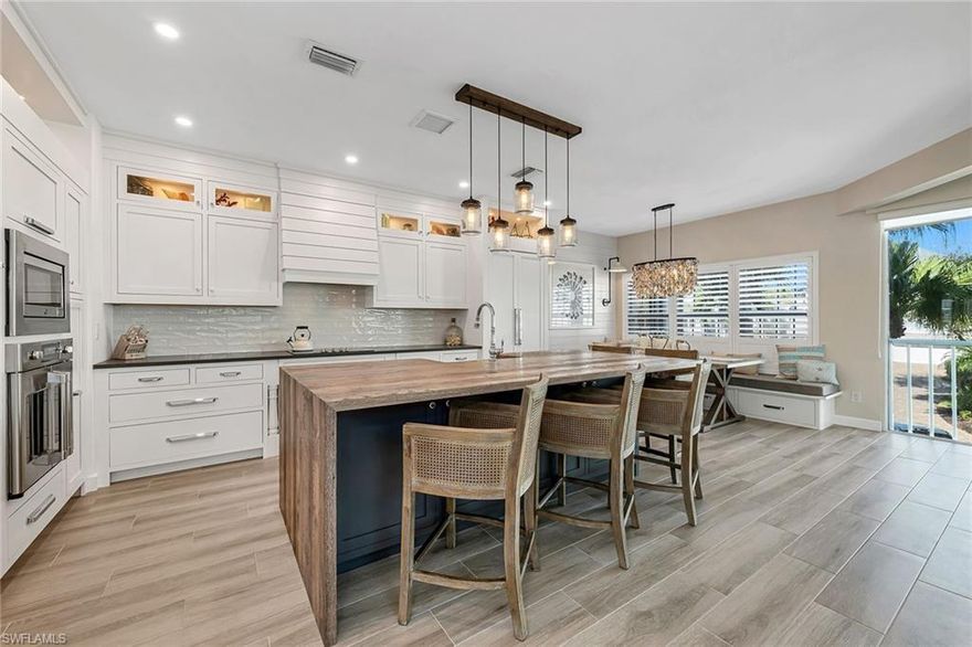 Collier County Villas at Barefoot Beach residence has been completed and renovated to perfection. Florida's living at its best. As soon as you enter this coastal-contemporary home, you will notice the exceptional design and attention to every detail. Enjoy cooking in your chef's kitchen with an antique barn-wood island that is perfect for entertaining. This impeccably maintained home includes three bedrooms, all with private baths and a spacious living room with a cathedral ceiling that invites the sun to shine in all day. This home is also equipped with impact-resistant windows and doors, a newly installed metal roof, hot water tank and AC system. Steps away from one of Collier County's top beaches of Southwest Florida. The Villas at Barefoot Beach include two swimming pools, brick-paved streets, sunsets on the private boardwalk and a 24-hour gated community. This home is turnkey and has been professionally designed and furnished.