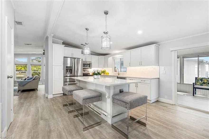 This beautiful lake front home is located in the highly desirable Windjammer Village of Naples, a 55+ community.
Recently remodeled, this 1534 square foot home offers an open floor plan with 2 bedrooms/ 2 bathrooms ensuite.
The family room, with its wall of windows, offers a stunning view of the lake and the family of ducks.
The large 36’ x 10’ sun room/lanai with tinted sliding windows, offering privacy & sun protection, is perfect for a home gym, TV room or additional storage.
The attached work shed (with electricity) is ideal for storing bikes, tools and beach chairs.
Ample parking for 3+ vehicles (2 car attached carport)...In-home washer and dryer...Updates include; 3/4 plywood underlayment with Luxury vinyl flooring throughout (no carpet), Quartz countertops in kitchen & bathrooms, New lighting fixtures, ceiling fans, interior & exterior paint, kitchen & bathroom faucets, closet organizers and landscaping.
The amenities include a heated community pool with spa, clubhouse, tennis, pickleball, bocce, shuffleboard and gate security. There's also onsite RV/Boat storage (no charge) and a lakeside pier. Golf cart and pet friendly, active adult lifestyle community. Low monthly maintenance fee of $162 includes lawn care. Resident owned, so no land rental fees here.
** The Prime location is just minutes to the 5th Avenue restaurants & shopping and the iconic Naples pier and white sand beaches**.