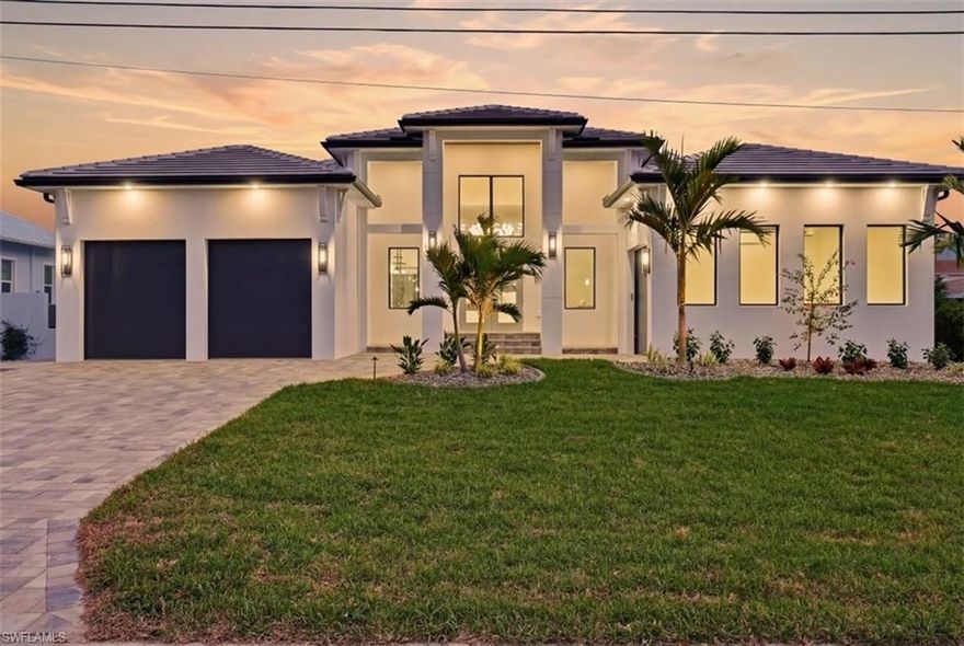 Welcome to 116 59th Terrace, a striking custom built waterfront residence designed for the most discerning buyer. Offering approximately 3,505 square feet under air, this luxury home delivers an exceptional blend of architectural sophistication, craftsmanship, and timeless coastal design.
From the moment you enter, you are greeted by an immediate WOW factor, highlighted by a dramatic glass wine display wall and expansive views through the great room toward the outdoor living space and tranquil water beyond. Every detail of the home reflects meticulous attention to design, flow, and finish.
The open concept great room, anchored by a custom fireplace, flows seamlessly into the chef’s kitchen, featuring top-of-the-line appliances, an extra large statement island, elegant custom cabinetry, and a hidden walk-in butler’s pantry, perfect for both everyday living and entertaining.
The home comes fully furnished with a complete designer selected interior, ensuring a seamless turnkey luxury living experience for immediate enjoyment.
This home offers four spacious bedrooms, each with its own private ensuite bath and walk-in closet, along with a glass-enclosed den and separate office with French doors, providing flexible spaces for work, relaxation, or hosting guests.
The primary suite is a true private retreat, complete with a cozy sitting area overlooking the pool, cabana, and water views. The spa inspired primary bath features refined finishes and a serene ambiance designed to impress and unwind.
One of the home’s most exceptional highlights is its seamless indoor/outdoor living experience. The expansive lanai showcases a resort style heated saltwater pool and spa, outdoor kitchen, and cabana, creating the perfect backdrop for entertaining or quiet waterfront relaxation.
The property is ideally positioned on a protected cove just off the river, offering beautiful water views while providing a natural buffer from open river conditions. This strategic placement delivers added peace of mind during storm season, while still allowing quick and convenient access to open water and the Gulf within minutes.
Built with durability and longevity in mind, the residence includes hurricane impact insulated windows and doors, a brand new 10-foot seawall, and an oversized dock system accommodating up to four boats. Boaters will appreciate the direct sailboat access with no bridges, making trips to open water effortless.
The location further elevates the lifestyle, with Tarpon Point Marina, Cape Coral Marina, and downtown Cape Coral all just minutes away,easily accessible by car or boat, offering dining, entertainment, and marina amenities at your doorstep.
This is a rare opportunity to own a thoughtfully designed luxury waterfront home that delivers protection, convenience, and refined coastal living crafted without compromise.