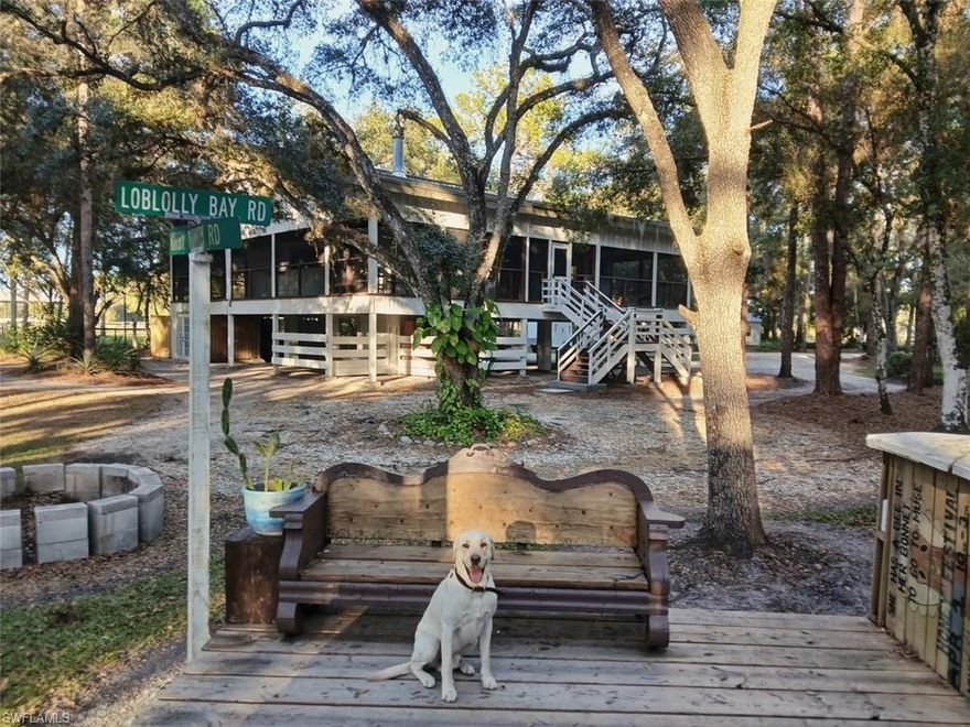 PRIVATE NATURE HIDEAWAY! FLANKED BY CONSERVATION LAND! Escape to the tranquility of nature in this unique custom three-level stilt home, nestled on five wooded acres.  Originally built by a renowned bird illustrator and later willed to the Nature Conservancy, this extraordinary property is now privately owned and bordered by more than seventy acres of conservation land, ensuring your natural sanctuary remains forever preserved. 

The home’s architectural character shines through its heavy wood-frame construction set on solid concrete pillars, topped with a galvalume metal roof and solar panels for exceptionally low electric bills. The property offers unique outdoor living with a detached wood deck and bar for entertaining, a separate guest house, firepit, and meandering nature trails surrounded by native trees and wildlife. 

The lower level of the home provides flexible space for parking, hobbies, or storage, complete with a workshop, and a rustic bath with private outdoor shower.   

The main level offers an expansive open concept living area featuring a cozy fireplace with 85” tv, chic chef’s kitchen, large bedroom, guest bath, and an additional room perfect for dining, office space, or third bedroom. This level is surrounded by a screened wraparound porch on all sides, blending indoors and outdoor living in a serene natural setting. 

The upper level features an oversized family or game room, large laundry, and private master suite. The open wraparound deck provides multiple seating areas, including space for the hot tub, and invites relaxation among the treetops. Designed for comfort, creativity, and connection with nature, this remarkable home offers the rare opportunity to live privately amid a truly natural Florida landscape. 

Property is located in the SW Florida rural Muse area of Glades County with a LaBelle address.  This rural location is in the country but only 40 minutes from downtown Fort Myers, 1 hour from Naples, and 2 hours from the Miami area for easy and quick access to your own private Hideaway!