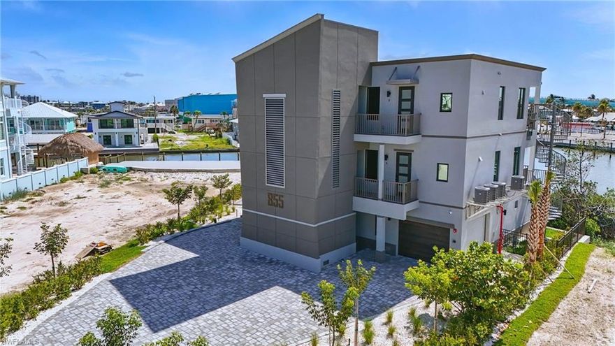 Built to Commercial Code, brand-new 2 bed/2 bath gulf-access condo on Fort Myers Beach’s coveted North End with private boat slip, rare enclosed garage, and direct Gulf access—just about 400 ft from the sand. 855 Lagoon Street was built with high-performance SIP construction, serious hurricane engineering, a new poured-concrete seawall, and easy-care tropical landscaping, so you can spend more time on the water and less on maintenance. Inside, you get a bright open layout, stylish tilework, modern cabinetry, generous bedrooms, and timeless but modern finishes. Your slip is just outside—reach the Gulf in roughly 10 minutes—or relax at the community pool, then walk to Margaritaville, Times Square, Bowditch Park, dining, shops, and the new Whale. If you’ve been holding out for a North End new-construction waterfront condo that truly checks the boxes, this is the one.