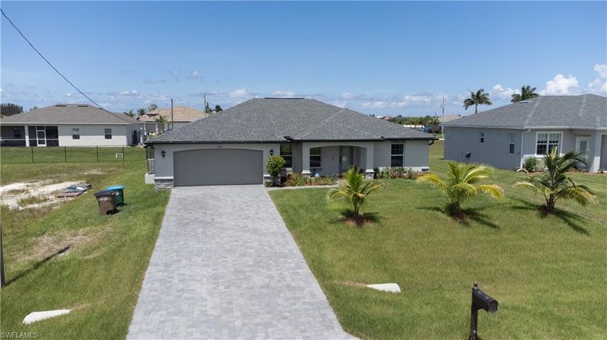 Beautiful 4 bedroom home in NW Cape Coral. Open floor plan with cathedral ceilings and center island kitchen. Spacious living room leads to a large covered lanai to enjoy the SW Florida lifestyle!... This home built in 2019 boasts over 1800 sq ft of living area and has amazing upgrades! Features Include 36” upper cabinets with soft close doors, Granite Counters in Kitchen and Bathrooms, Stainless Steel appliances,  Electric garage door opener, 18" tile flooring in main living areas...and much more!...(more pics are coming soon).