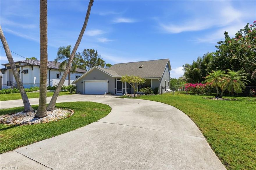 GULF ACCESS. NO HOA. 3 BED+DEN. 3 FULL BATHS. OVERSIZED GARAGE. JUST MINUTES TO THE HEART OF DOWNTOWN BONITA SPRINGS and on a street where vacant lots alone are selling for $400K+. Located just 3 minutes from Downtown Bonita Springs and local hotspots, with quick access to Coconut Point, RSW Airport, and SWFL's beaches, by car or by boat. Step outside to your oversized, fully fenced WATERFRONT yard lined with palm trees and 8 citrus trees.  Add your dream pool, expand your outdoor living, or simply enjoy the space. The expansive screened lanai opens wide to capture incredible breezes off the water, all overlooking your canal with DIRECT ACCESS to the Gulf of Mexico. Relax on your private composite deck, watch manatees pass by, or design your dock and lift, this is true Florida boating life right from your backyard. Inside, with over 2,000 sqft of bright, open living space designed for both comfort and entertaining. The main level features upgraded wood-look ceramic tile and porcelain flooring throughout, a spacious living room, formal dining area, and an additional  flex/entertaining space perfect for a second living area/game room. The kitchen has been completely redone equipped with newer appliances, quartz countertops, custom cabinetry, a large island, oversized 4-door pantry, and wine rack. A versatile main-level flex room with its OWN closet and PRIVATE garage access offers the perfect 4th bedroom, guest suite, office, or gym, with a full upgraded bathroom featuring a walk-in shower conveniently located nearby. Upstairs, you’ll find 3 oversized bedrooms plus a spacious loft overlooking the main living area, ideal for a media room, workspace, or additional living space. EVERY bedroom features sliding glass doors leading to a second-story balcony overlooking the canal, along with a private exterior staircase for easy access after a day on the water. The primary suite is bright and spacious with balcony access, generous closet space, and an upgraded en-suite bath with granite vanity and walk-in shower. The guest bathroom upstairs is also generously sized with updated finishes and a tiled tub/shower combo. Additional highlights include an oversized circular driveway, large garage with storage, an oversized laundry room with sink, cabinetry, and folding space, and extra storage throughout the home. NO HOA. NO RESTRICTIONS. DIRECT GULF ACCESS FROM YOUR BACKYARD. Perfectly located in a safe, highly desirable area, this home is ideal as a primary residence, vacation property, or investment opportunity with no rental restrictions. If you’ve been waiting for the full Florida lifestyle—by land and by water—this is it.