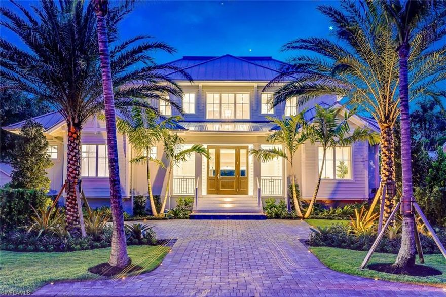 Welcome Olde Florida-style living back to Olde Naples with the latest masterpiece built by Griffin Builders. This 6-bedroom, 8-bathroom home, located steps away from our white sandy beaches and the Gulf of Mexico, is a sight to behold with its Olde Florida architecture and coastal interior design. You’ll be amazed upon entry, immediately noticing the glass-enclosed, fully insulated wine room with an array of decadent options. Your eyes will take in the breadth of space that makes up the great room, kitchen, and dining room. The luxury kitchen features 2 kitchen islands, dual sinks, and Wolf & Sub-Zero appliances, while the great room features a gas fireplace. Unique to this home is the modernized Florida room, which blends seamlessly with the rest of the home, that also opens up to the relaxing outdoor space with a tranquil pool and spa, deck jets, and lush landscape. Walk up the stairs, or use your private elevator, and find a comfortable loft featuring a wet bar and gorgeous Pecky Cypress walls blending into a white paneled ceiling. The loft is at the center of 4 en-suite bedrooms, while the fifth en-suite bedroom and the master suite find residence on the ground floor.