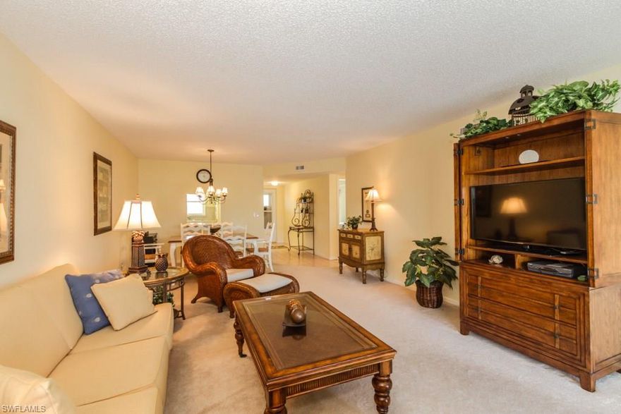 Wonderful light and bright condo in 55+ community. Offered furnished , this lovely home overlooks the pool/club area and is peaceful and quiet.  The large lanai is perfect for relaxing and has electric storm shutters for added protection when you leave. There are hurricane windows and the building had a new roof in 2005. The home has a washer and dryer, a spacious guest room, and plenty of room to entertain guests in the living/dining room.  The Master Bathroom was re done in 2005 with a new shower and vanity.  The condo is rented for February and March 2018 and the lease must be honoured by the buyer.  This great condo is ready for you and is conveniently located near local shops, restaurants, and easy access to Olde Naples and the Beaches. NO SHOWINGS 2/16-2/23/18. Sorry.