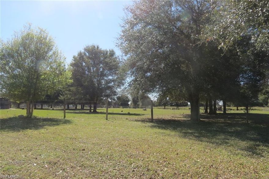 Bring your Horses, Bring your Cows, Bring your Guns (Property has a shooting range), Bring your Kayak or Canoe, because this property is a Country Boy's dream come true. Walk to the back of the house and walk down the steps into Bedman Creek which is only a short distance to the Caloosahatchee River. Perfectly located close to the intersection of Joel Blvd and SR 80 Approximately 12 miles to I-75, approximately 12 miles to LaBelle and LaBelle's Walmart. Publix Lehigh Acres approximately 7 miles, Publix Verandah approximately 9.5 miles.
