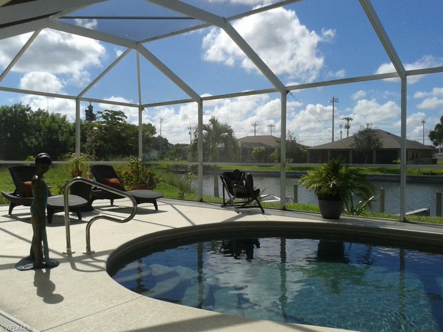 Many good things to say about this home!   Three bedroom, two bath split plan with great room.  Perfectly maintained by particular sellers.    Upgrades include special murals,  summer kitchen on pool deck,  spa
flows into pool, granite countertops in kitchen,  plant shelves, smooth top range,  island in kitchen and hurricane panels.   Home owner has personal designer touches to showcase the home.   Refrigerator,  washer nor dryer convey.   The master bedroom is currently being utilized as a media room.  En suite has his/her [both hers!]  closets, double sinks in vaity, large walk-in shower, enclosed toilet and big linen closet.   The laundry/pantry off the kitchen has lots of shelves for storage and leased to the garage.  Plantation shutters throughout, and beautiful light/fans in all bedrooms.  Make an appointment to see today.