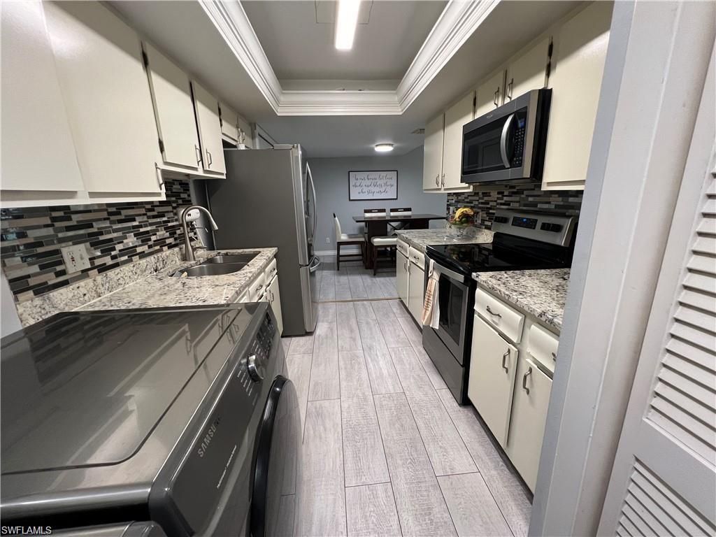 Photo of 3615 Boca Ciega DR #203, NAPLES, FL 34112 (MLS # 225083564)