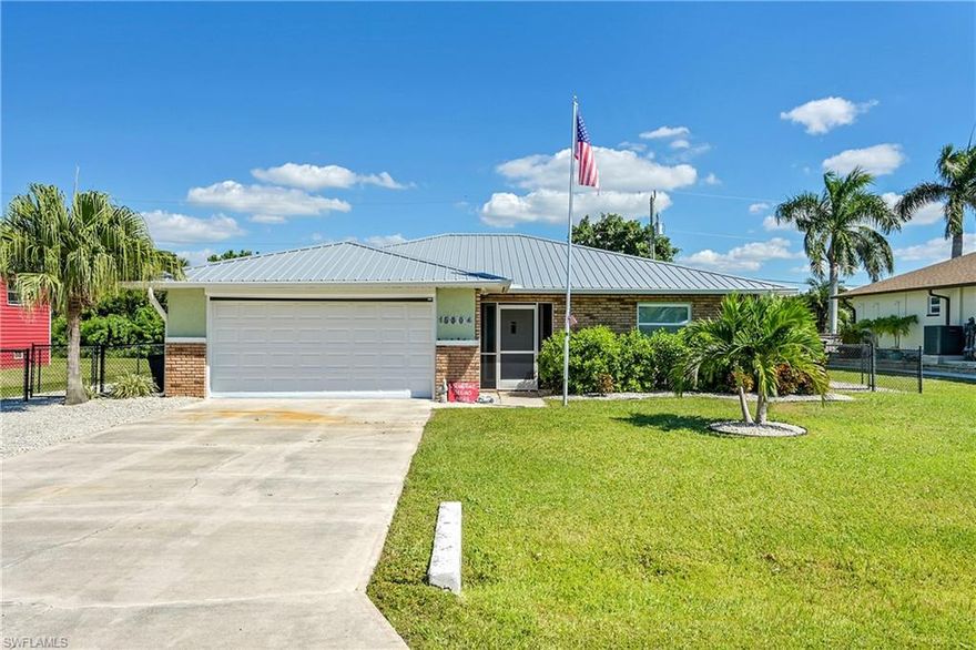 Welcome to 15804 Missouri St in Bokeelia—where quality updates. This 2-bedroom, 2-bath home offers 1,547 sq. ft. of comfortable living, complete with a newer metal roof (2019), new electrical panel, new A/C (2025), spray foam insulation, new hot water heater, and impact windows throughout. Inside, the open layout connects the living area and kitchen, featuring beautiful granite countertops, new appliances, and a large island perfect for cooking or casual gatherings. The guest bedroom is light, bright, and spacious. Step outside to your private pool area with an enclosed patio and surrounded by lush trees—an ideal spot to relax or entertain. The fenced backyard offers privacy, and the attached garage adds convenience. Located in a quiet Bokeelia neighborhood, this home is just minutes from shops, parks, and nearby beaches. With its solid construction, modern updates, and inviting layout, this property is ready for year-round living or a perfect island retreat.
